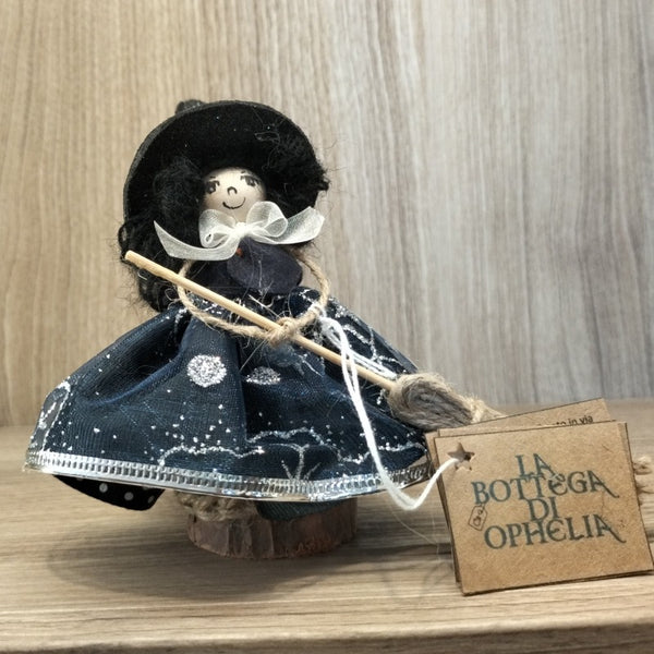 Bambolina streghetta capelli neri vestito blu fiocco bianco