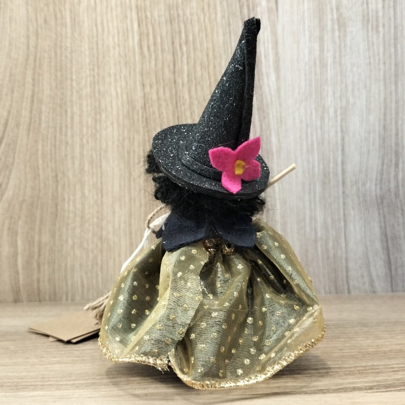 Bambolina streghetta capelli neri mantella nera fiocco bianco vestito dorato